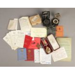 A quantity of collectables and ephemera. Includes Buffaloes certificates, membership cards, silver