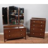 A three-piece oak and ply bedroom suite, comprising of mirrored wardrobe, chest of drawers and