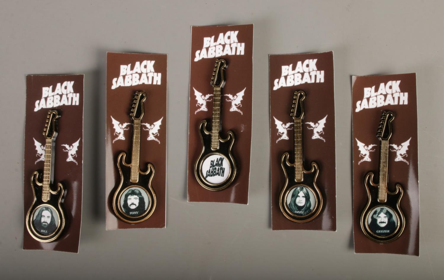 Black Sabbath Plastic Guitar Brooches, each featuring band member & logo, backed on card.