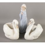 A Lladro swan along with Nao swan example and a young praying girl.