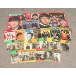 A collection of Beatles memorabilia including posters, magazines, records songbooks etc