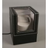 An electric automatic watch winder. Working order.