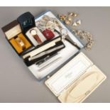 A quantity of costume jewellery jewellery and pens. Includes manual ladies wristwatches, Parker