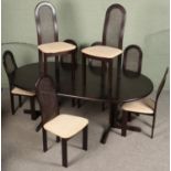 A Lubke extending dining table with eight matching dining chair with bergÃ¨re back rest.