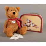 A Steiff 'Charly' bear (113208) with swing tag and button in ear, accompanied by the original