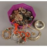 A box of costume jewellery. Includes bangles, necklets, brooches etc.