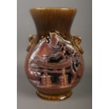 A Japanese stoneware vase decorated with temple landscape scene. Stamped Made in Japan with seal
