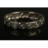 A white gold and diamond eternity ring. Tests as gold. Size N 1/2, 3.58g.