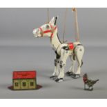 A collection of metal collectibles including Muffin the Mule diecast puppet, Tinplate sweet tin