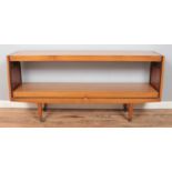 A Formica metamorphic sideboard/table. Raised on casters. Height: 74cm, Width: 159cm, Depth (as a