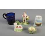 A collection of Staffordshire figurines including cherub, sheep and birds nest, Georgian blue