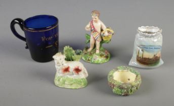 A collection of Staffordshire figurines including cherub, sheep and birds nest, Georgian blue