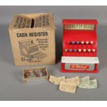 A vintage children's tin plate St. Michaels cash register with original box. Also includes