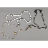 Three rosary bead necklaces.