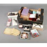 A box of assorted costume jewellery and accessories to include both modern and vintage. Examples