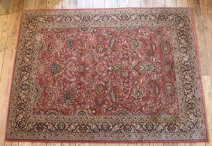 A red ground Belgian wool rug, produced by Imperial Jewel, Kohinoor. Approximately 200cm x 150cm.