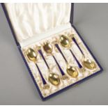 A set of six vintage Danish silver gilt demitasse spoons with enamel decoration and crown terminals.