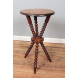 A mahogany Gypsy table with bobbin turn supports.