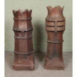 Two large treacle glazed stoneware chimney pots with crown tops. Tallest 103cm.