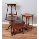 Four occasional tables. Includes tilt top walnut example, two oak examples and a small drop leaf