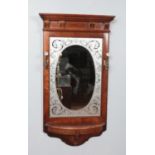 A mahogany framed hall mirror. Having etched glass border, coat hooks and shelf. Length 102cm.