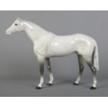 A large Beswick horse in dapple grey, model 1564. Height 28cm. Good condition.