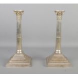 A pair of Richard Hodd and Son silver plated candlesticks, formed as Corinthian columns with