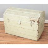 A vintage painted dome top, wooden bound trunk.