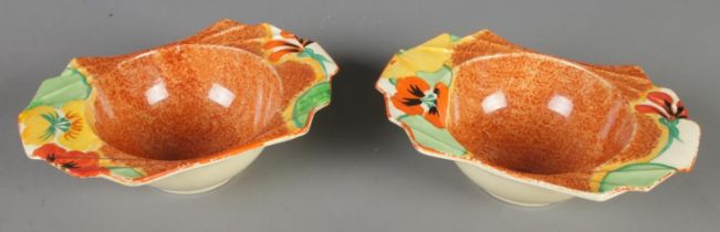 A pair of Clarice Cliff Newport Pottery grapefruit dishes in the Nasturtium design. (5cm x 17cm x
