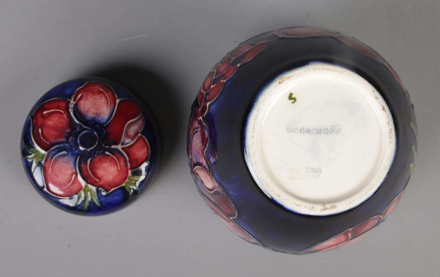 A small Moorcroft pottery dark blue ground ginger jar with cover in the 'Anemone' design. With - Image 2 of 2