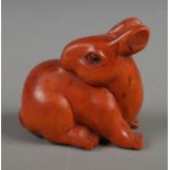 A Japanese carved Netsuke in the form of a rabbit.
