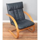 A modern leatherette armchair.