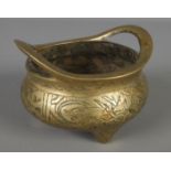 A Chinese bronze censer with impressed character marks to the base. (12.5cm diameter)