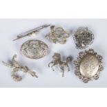 A quantity of silver and white metal brooches. Includes maracasite, floral example, etc.