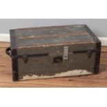 A vintage wooden bound luggage trunk.