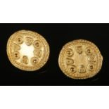 A pair of yellow metal earrings formed ancient style coins. Total weight 8.34g.
