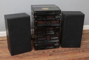 A technics Hi/Fi system stack including Quartz Direct Drive Automatic Turntable System, LW/MW/FM