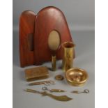 A collection of trench art and military themes brassware including artillery shell, letter opened,