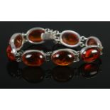 A silver and amber/copal bracelet, stamped 925 with makers mark DPA. Total weight: 23.5g.