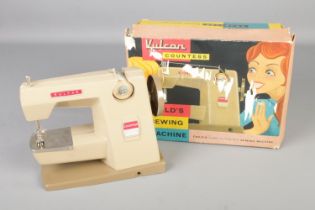 A vintage Vulcan Countess child's sewing machine in original box.