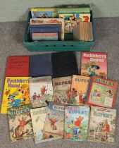 A box of books and annuals. Includes Seaby's Coin and Medal Bulletin, Rupert Bear annuals, Popeye,