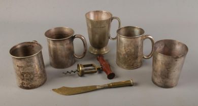 A selection of pub measuring tankards together with a trench art souvenir letter opener and