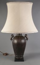 A large bronzed metal table lamp with dragon twin handles. (94cm)