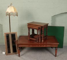 A quantity of furniture. Includes oak nest of three tables, mahogany coffee table, brass standard