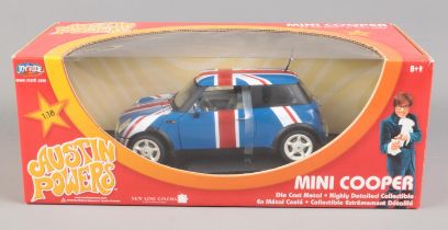 A boxed Joy Ride 1/18 scale diecast Mini Cooper from Austin Powers.