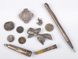 A small quantity of silver. Includes propelling pencil, 1887 Victorian shilling in mount, cheroot