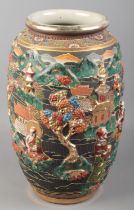 A large Japanese vase with moulded decoration depicting figures and landscapes. Height 38cm.