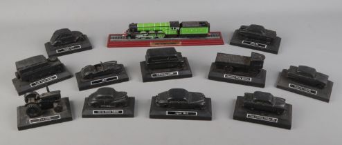 A collection of E & J Collectables Ltd coal models of vehicles along with a model of the Flying