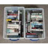 Two boxes containing a good collection of military related books, both fiction and non-fiction. To