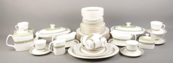 A Royal Doulton ceramic dinner service in the 'Rondelay' pattern. To include plates, cups and